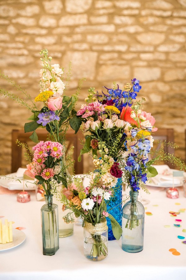 mixed bottles and wildflower wedding centerpiece ideas