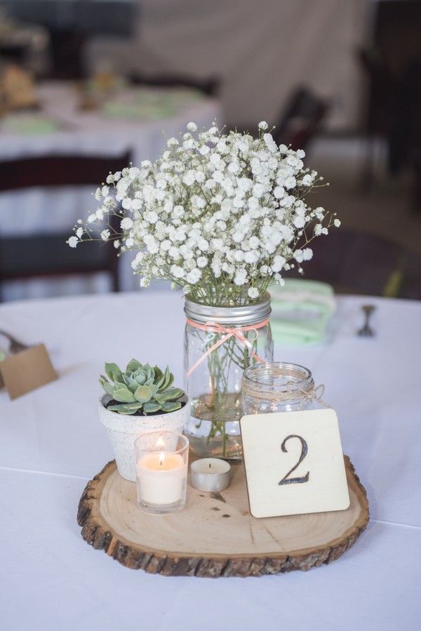 rustic baby's breath and succulent wedding centerpiece