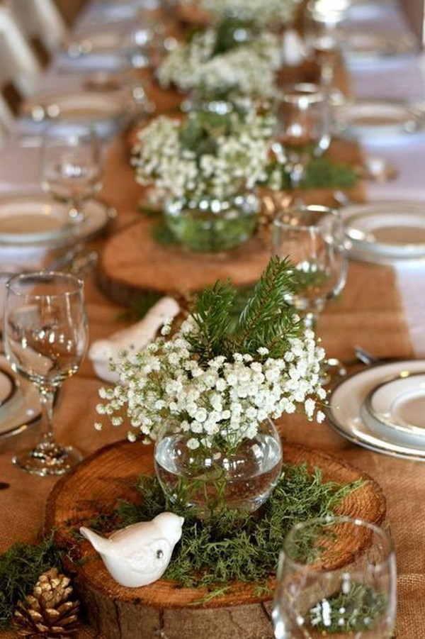 rustic baby's breath and tree stump wedding centerpiece