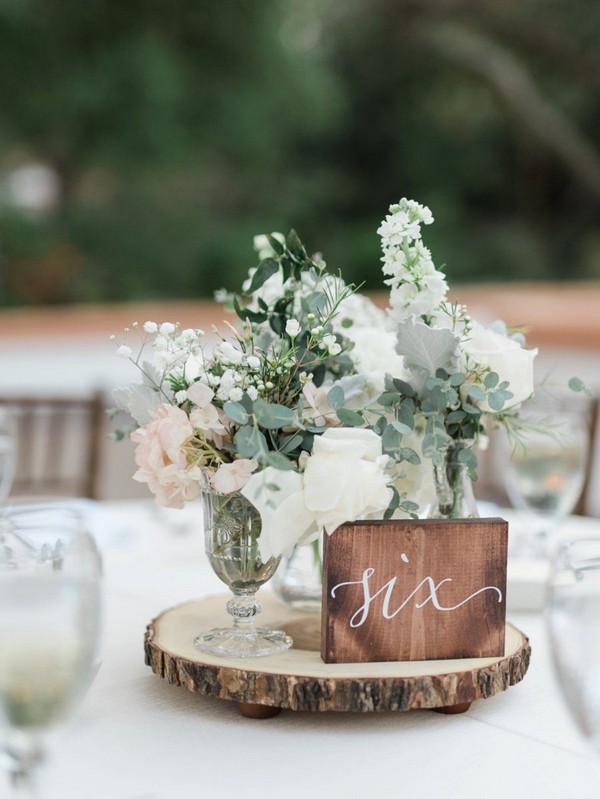 rustic eucalyptus tree stump wedding centerpiece with wood table number