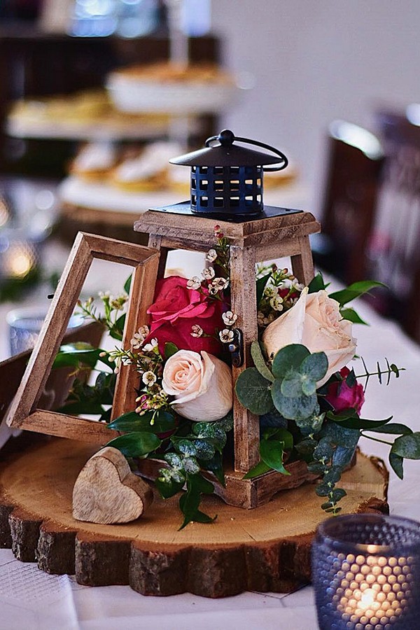 rustic wedding lanterns wooden lantern with flowers blush wedding decor via instagram