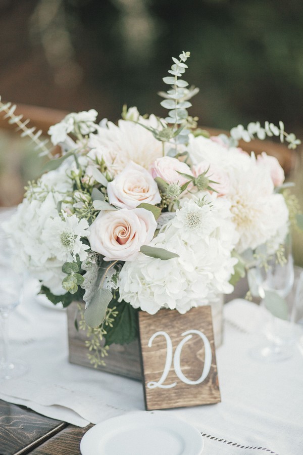 rustic white wedding centerpiece with wood table number