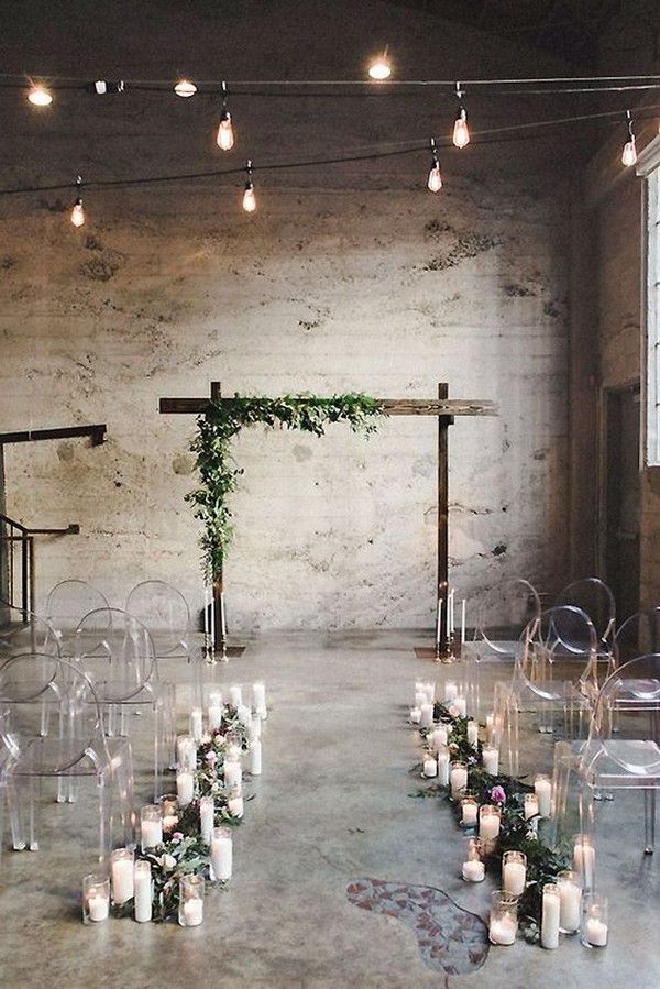 simple chic loft wedding ceremony with candles and greenery