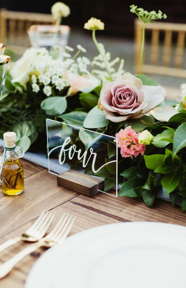 simple greenery wedding centerpiece with acrylic table number