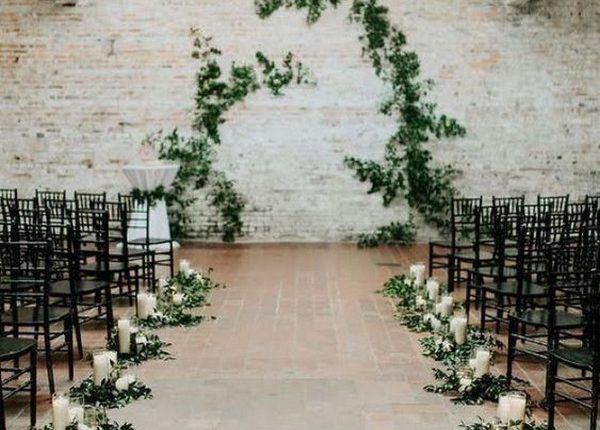 simple indoor wedding aisle ideas with greenery and candles