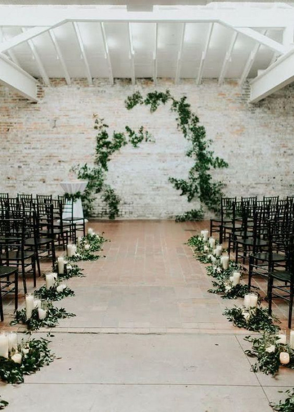 simple indoor wedding aisle ideas with greenery and candles
