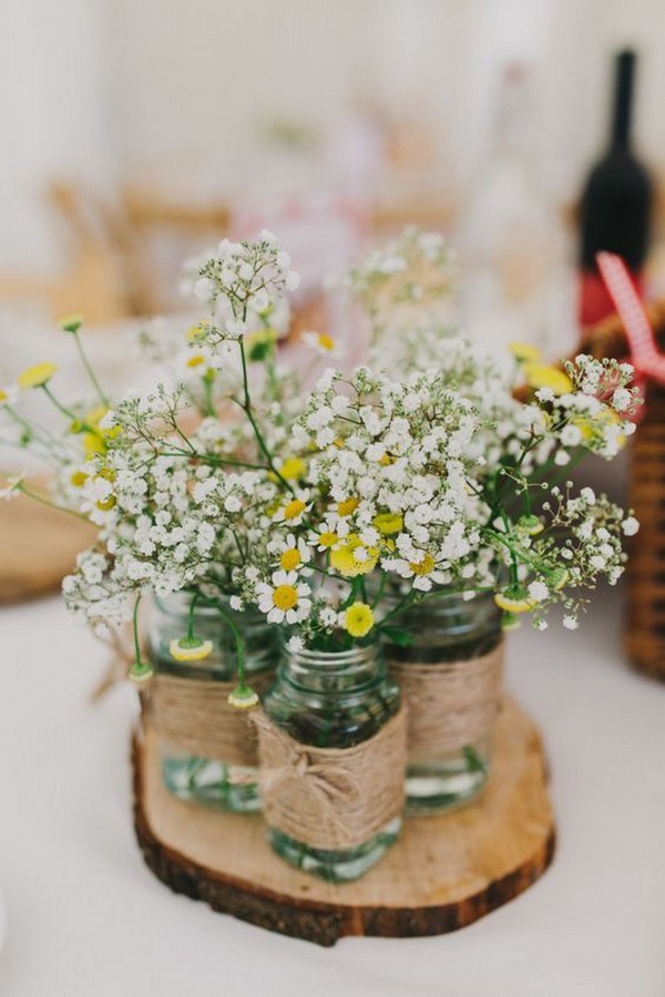 tree stump and wildflower wedding centerpiece