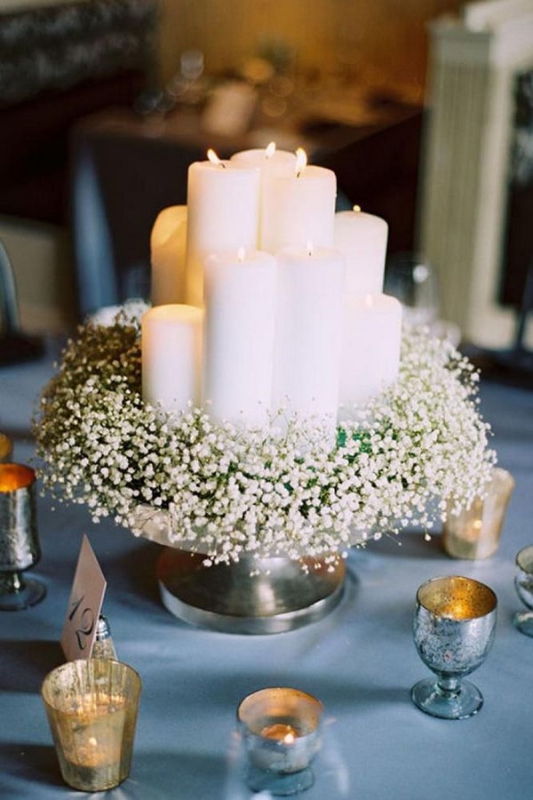 vintage baby's breath and candles wedding centerpiece