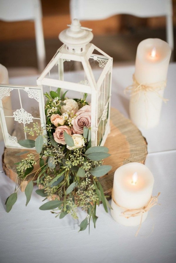 vintage white lantern wedding centerpiece with seeded eucalyptus