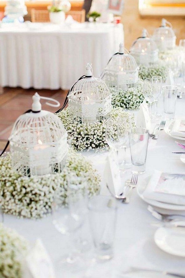 white birdcages and baby's breath wedding centerpiece