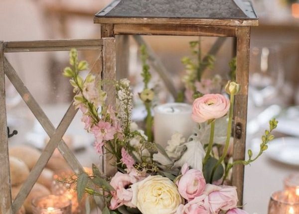 wooden lantern and peach blush roses wedding centerpiece