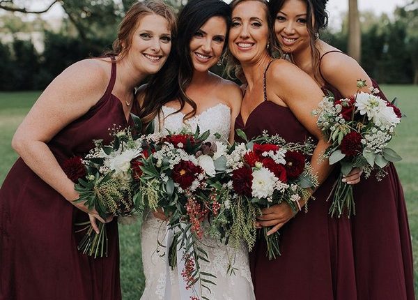 burgundy bridesmaid dresses and greenery wedding bouquet
