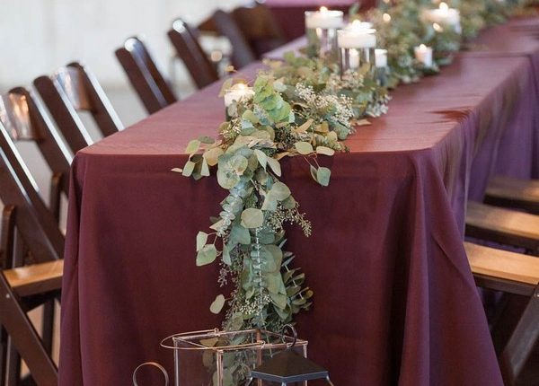 indoor burgundy wedding table cover and seeded eucalyptus wedding table runner