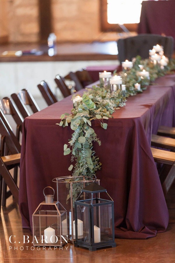 indoor burgundy wedding table cover and seeded eucalyptus wedding table runner