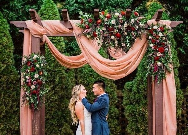 rustic outdoor fall wedding arches and backdrop 12