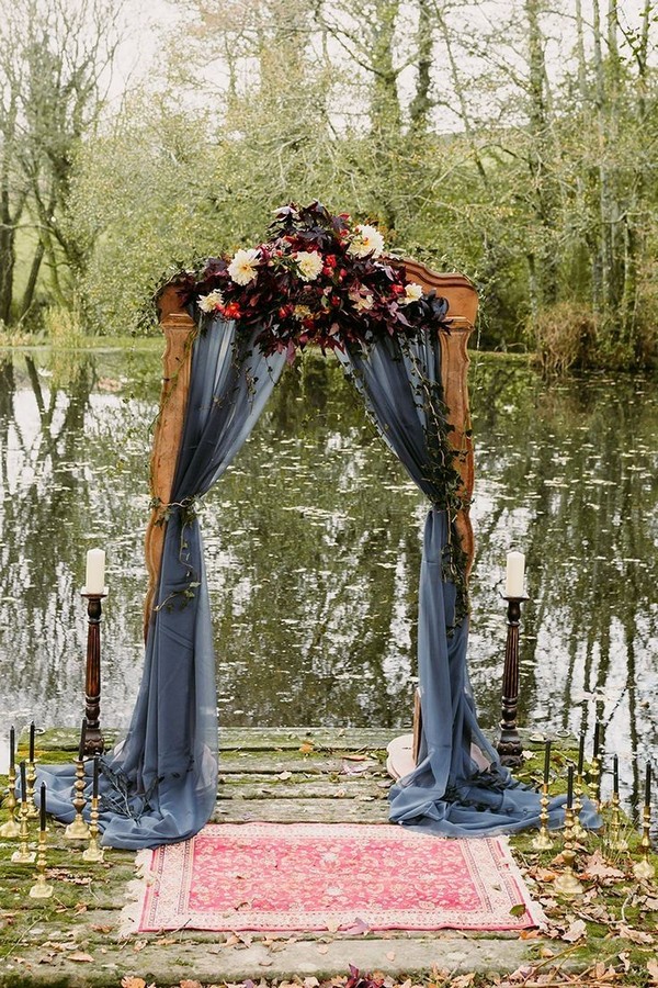 rustic outdoor fall wedding arches and backdrop