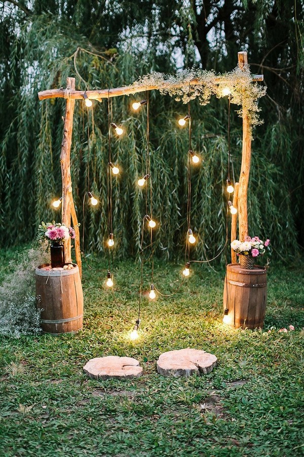 rustic outdoor fall wedding arches and backdrop