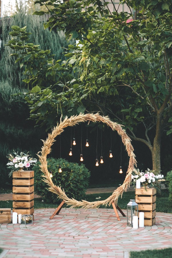 rustic outdoor fall wedding arches and backdrop