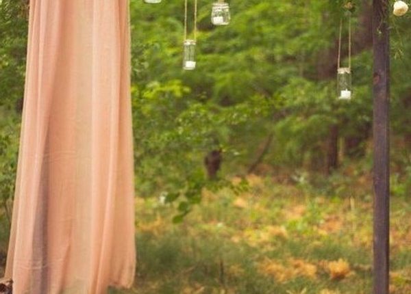 rustic outdoor fall wedding arches and backdrop 2
