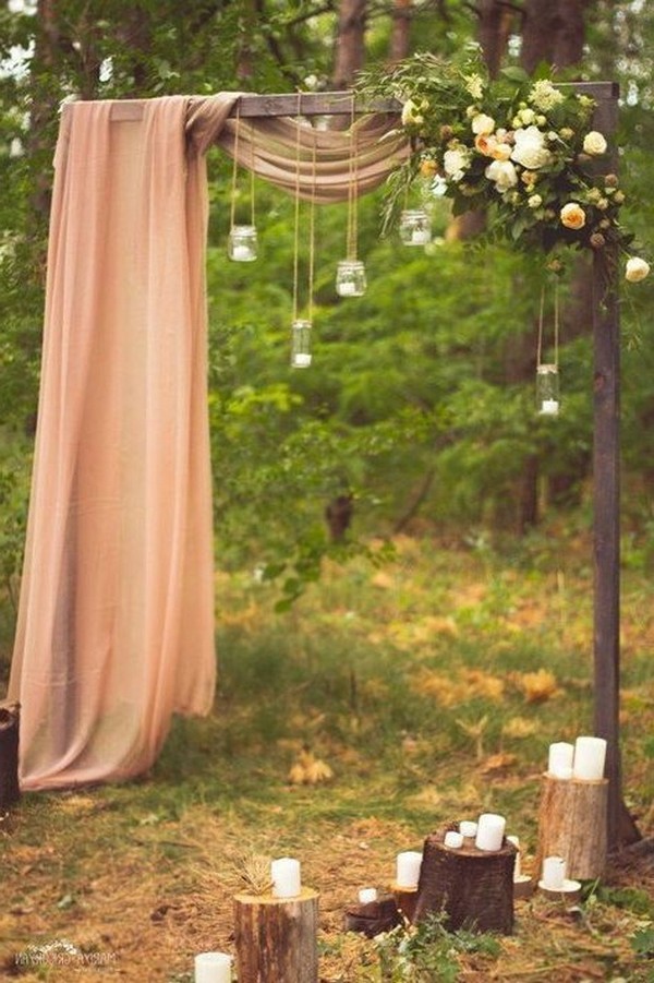 rustic outdoor fall wedding arches and backdrop