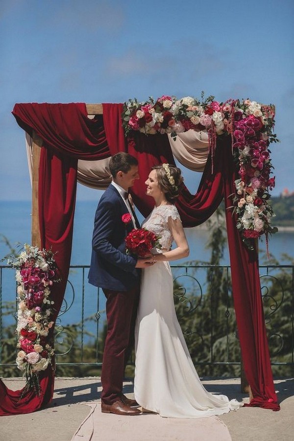 rustic outdoor fall wedding arches and backdrop