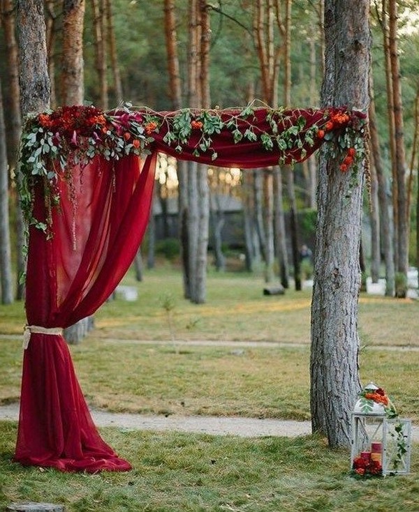 rustic outdoor fall wedding arches and backdrop