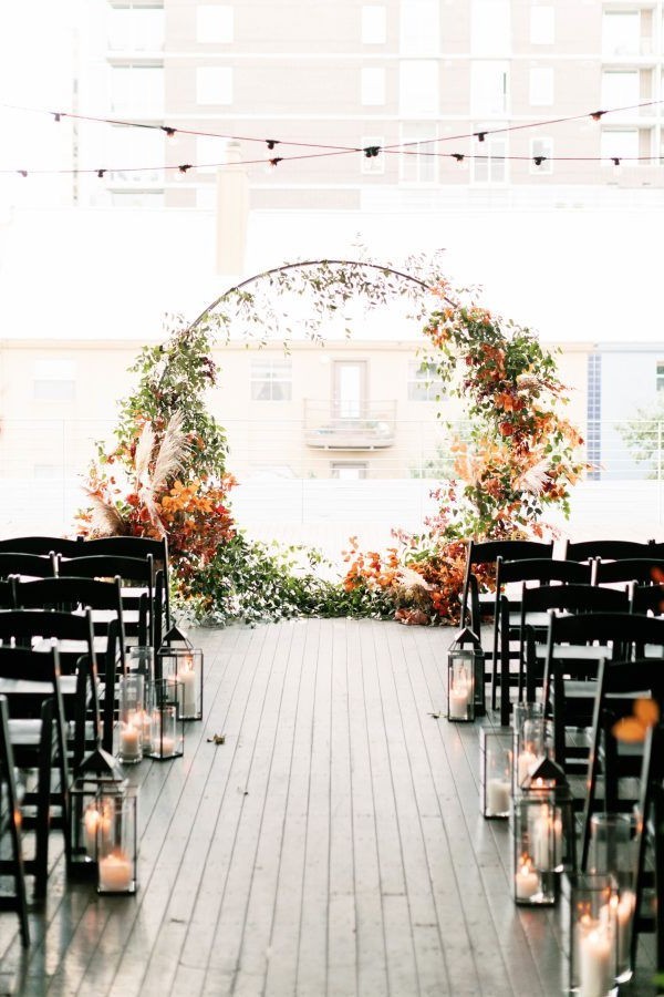 rustic outdoor fall wedding arches and backdrop