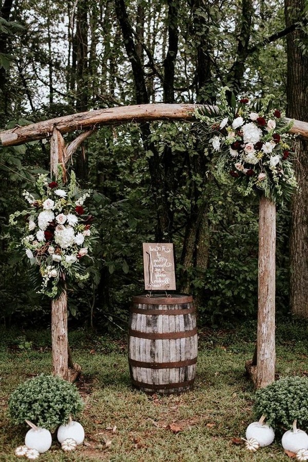 rustic outdoor fall wedding arches and backdrop