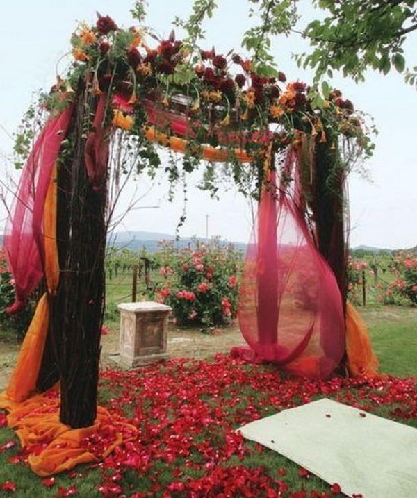 rustic outdoor fall wedding arches and backdrop