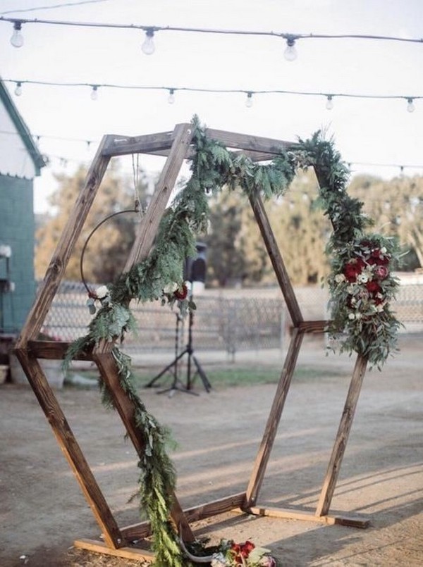 rustic outdoor fall wedding arches and backdrop