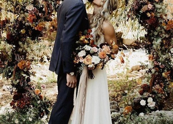 rustic outdoor fall wedding arches and backdrop 32