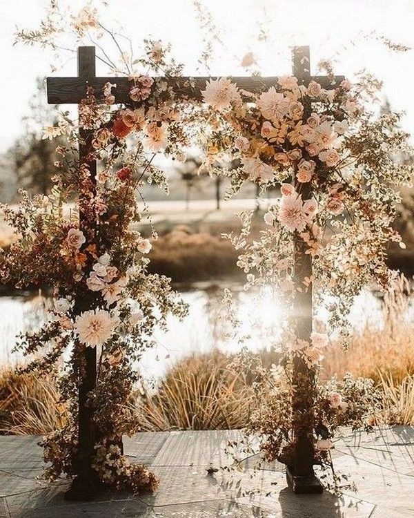 rustic outdoor fall wedding arches and backdrop