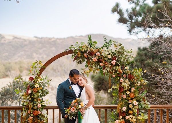 rustic outdoor fall wedding arches and backdrop 6