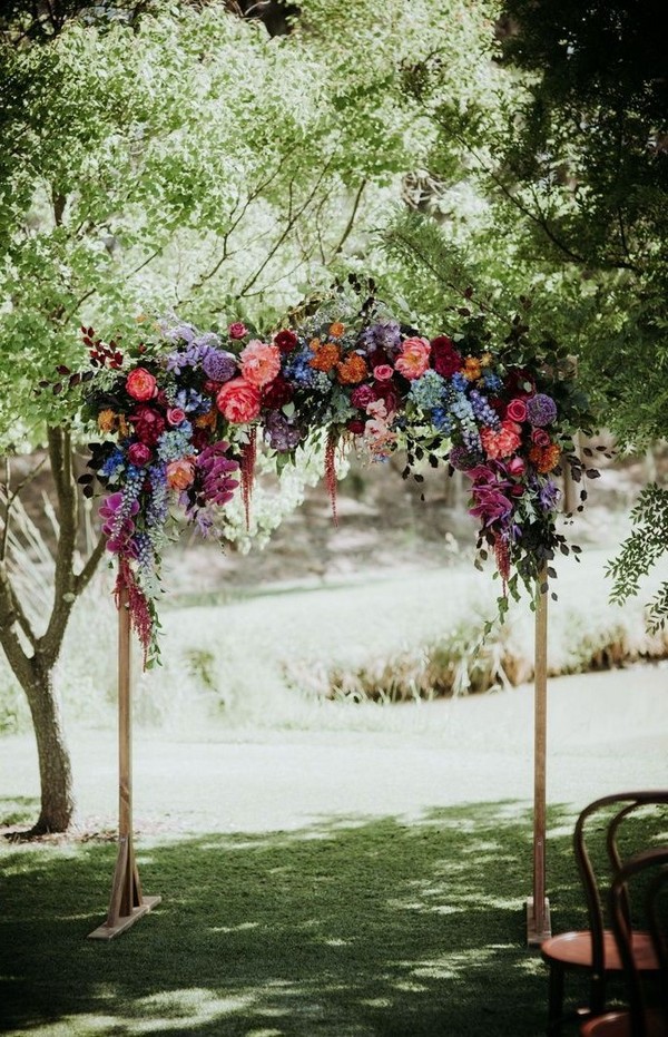 rustic outdoor fall wedding arches and backdrop