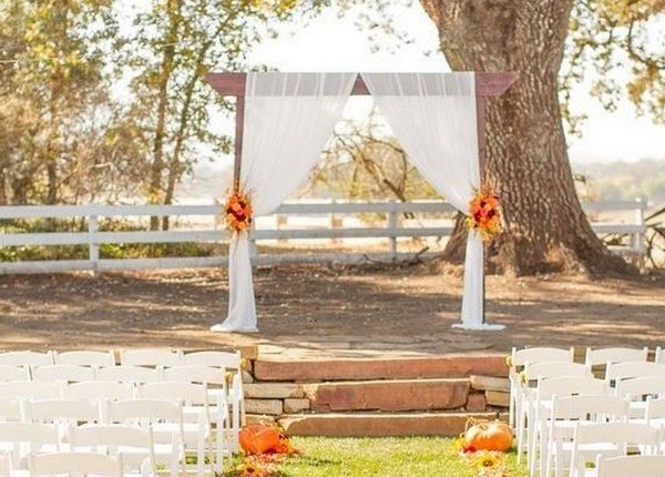 rustic outdoor fall wedding arches and backdrop 9