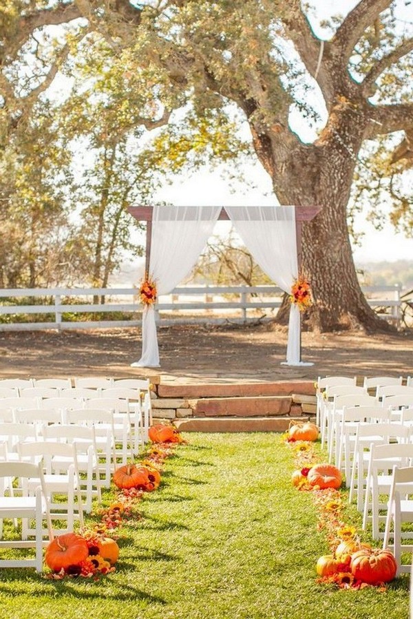 rustic outdoor fall wedding arches and backdrop