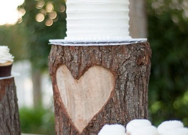 simple rustic wedding cake with cupcakes