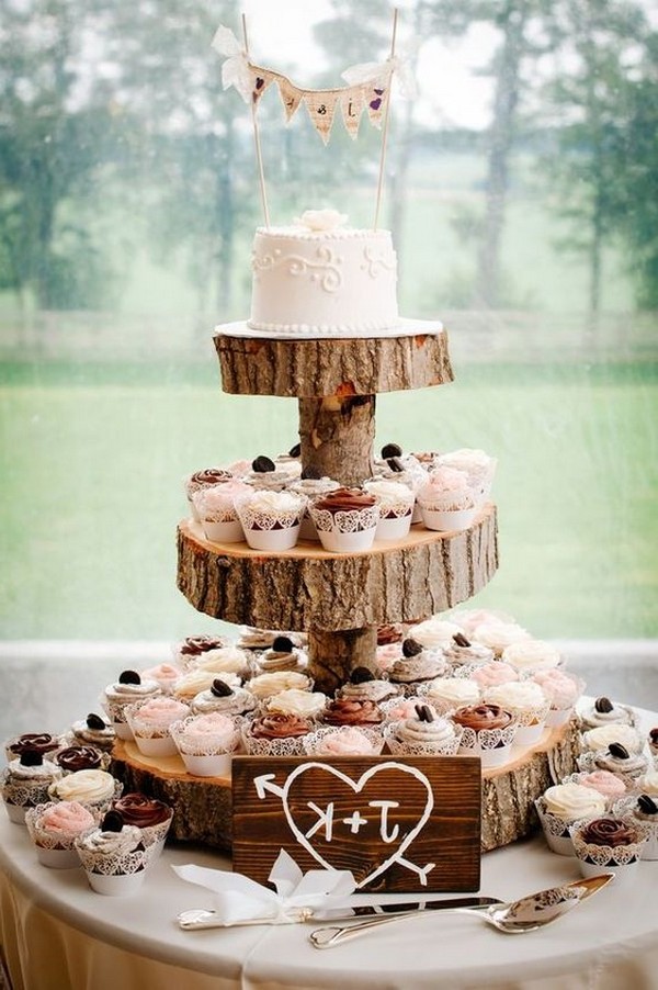 vintage country wedding cake display with cupcakes
