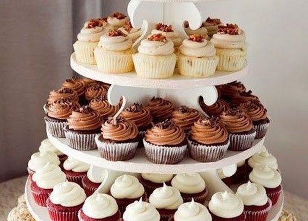 vintage wedding cake with cupcakes