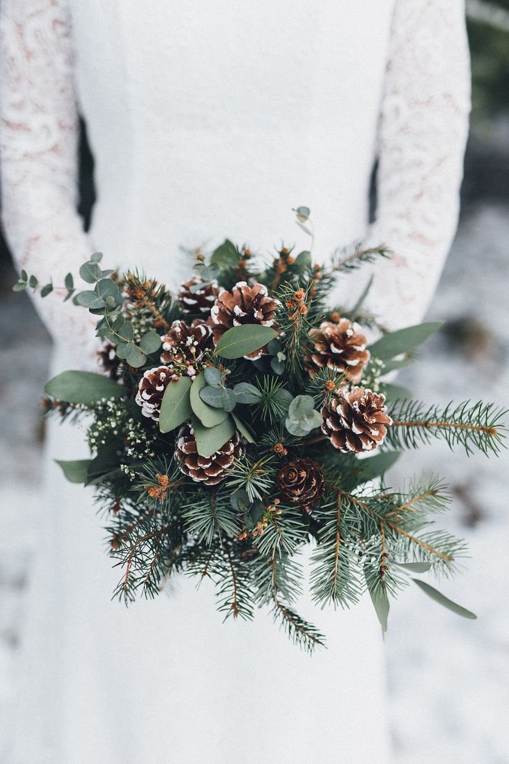 pine cone and greenery winter wedding bouquets