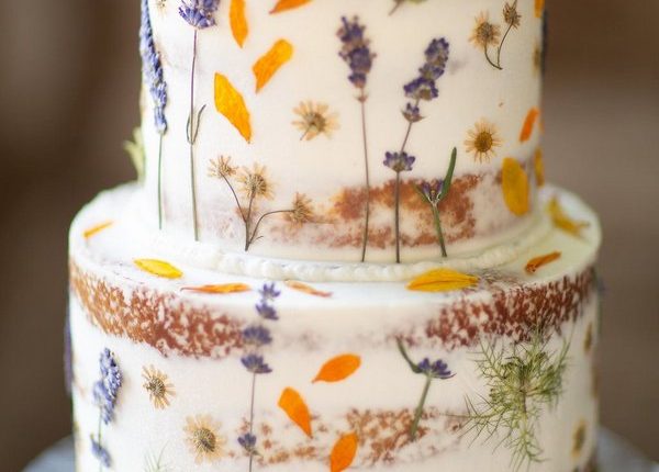 Semi-naked wedding cake with pressed flowers