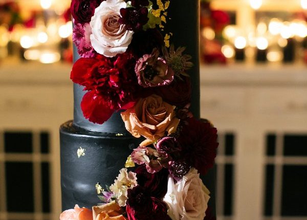 black wedding cake with flowers