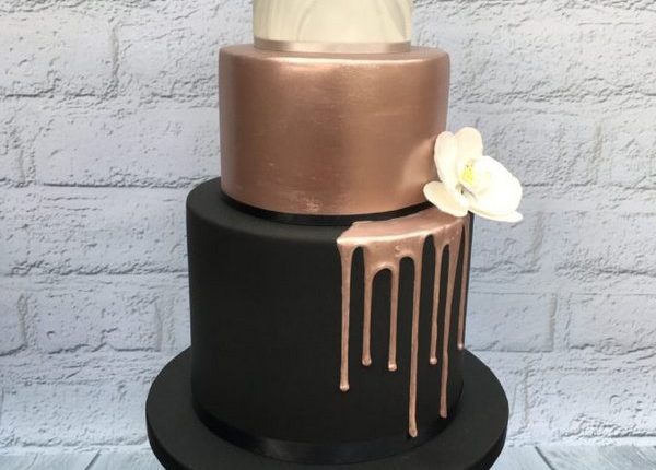 rose gold dripped and black wedding cake
