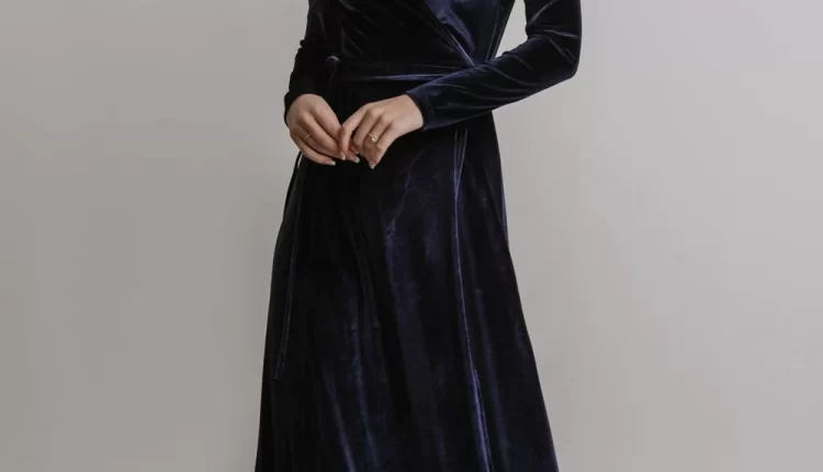 navy velvet wrap maxi wedding guest dress with long sleeves