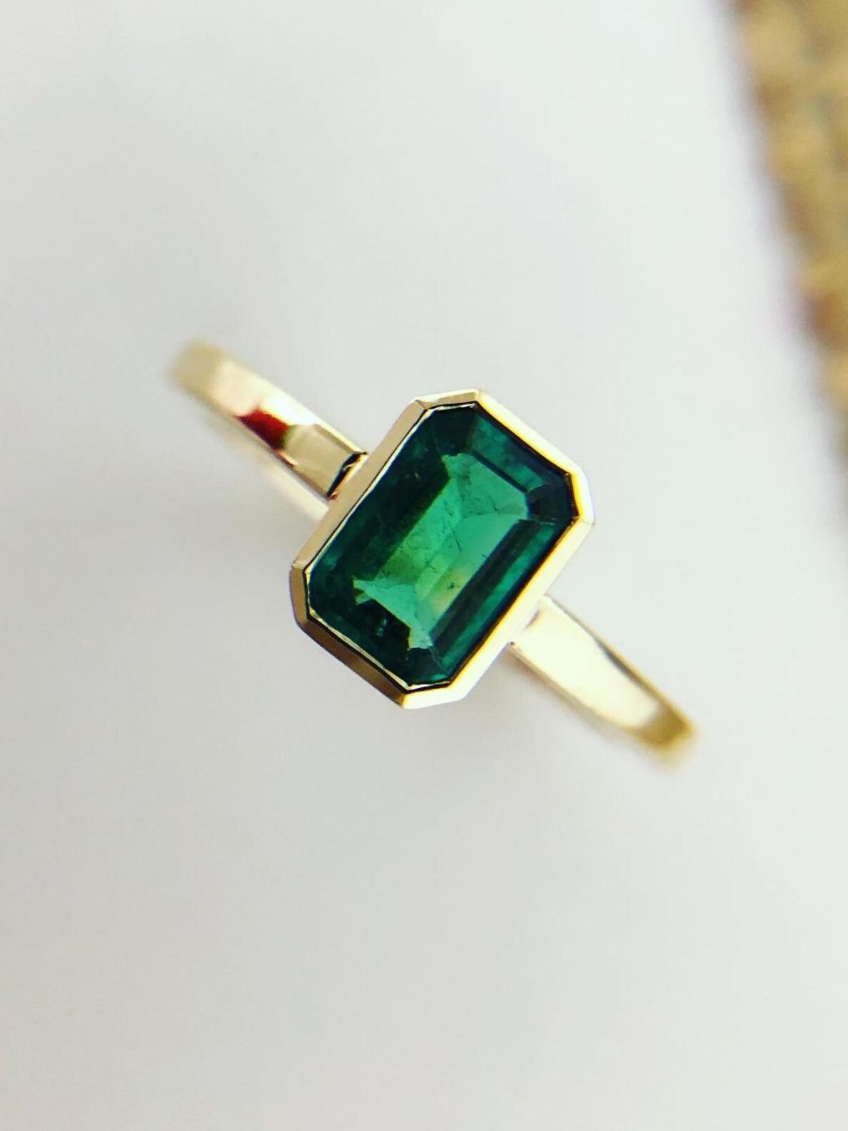 Emerald Solitaire Engagement Ring