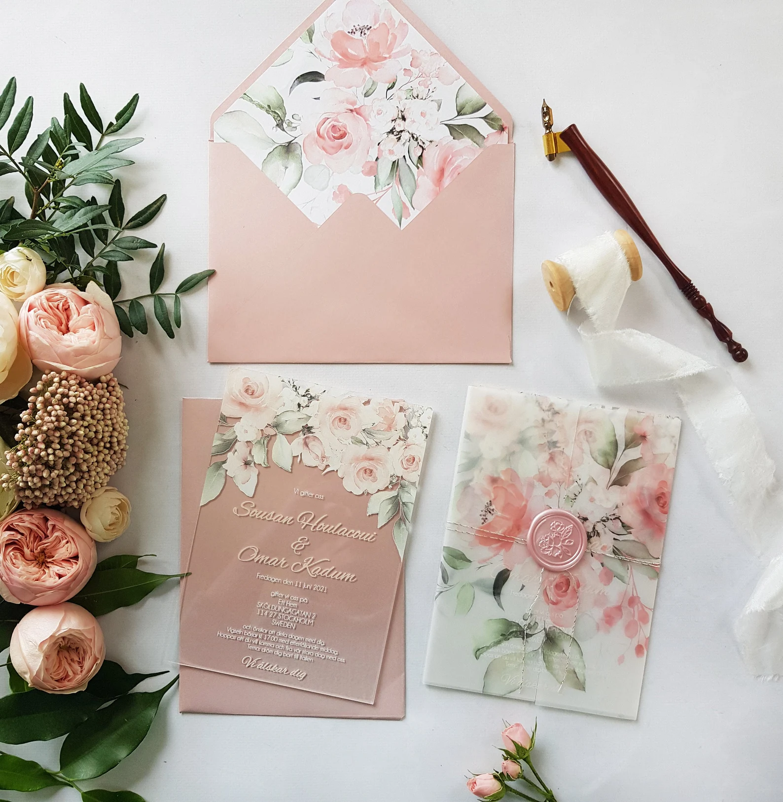 Clear blush pink acrylic weddin invitation with vellum wrap and wax seal