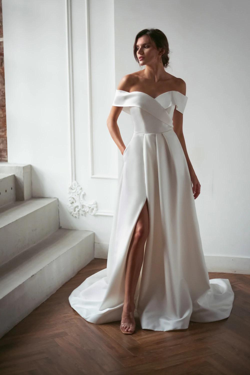 sleek satin off the shoulder wedding dress