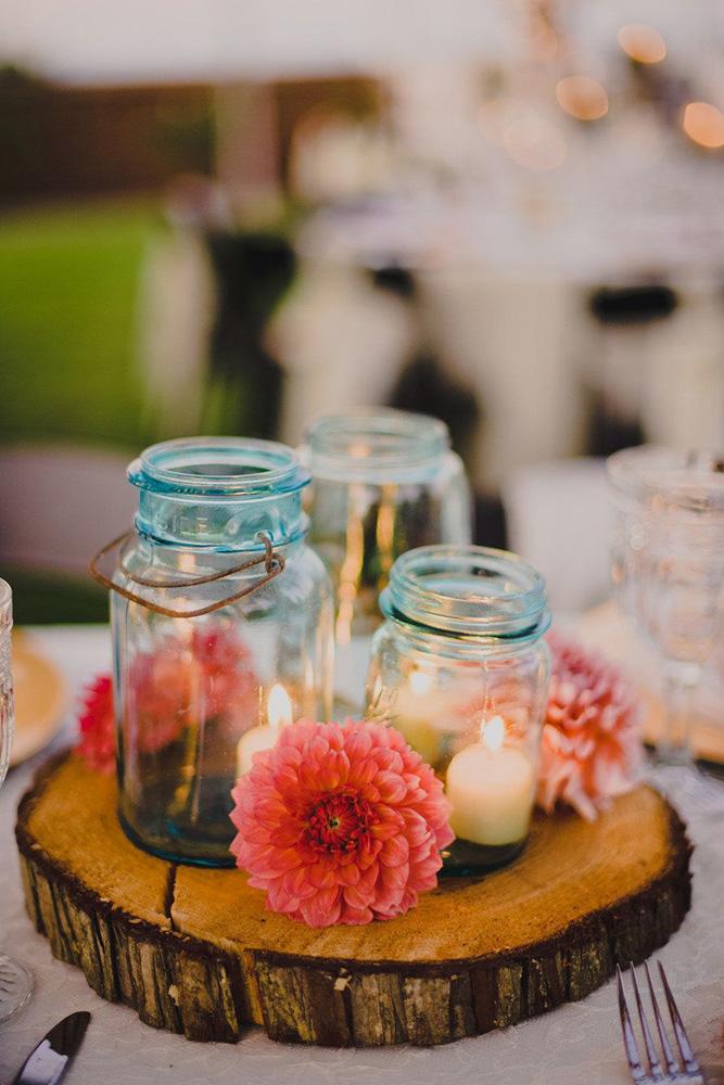 mason jars wedding centerpieces candles in blue glass mason jar and red dahlia